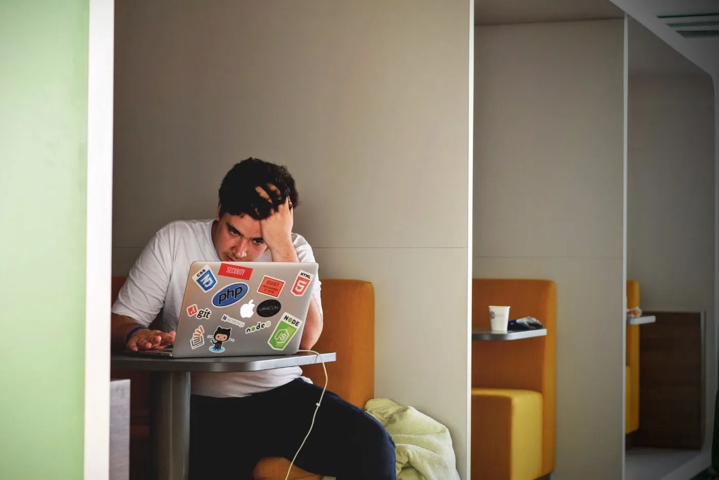 A person sat a desk looking frustrated